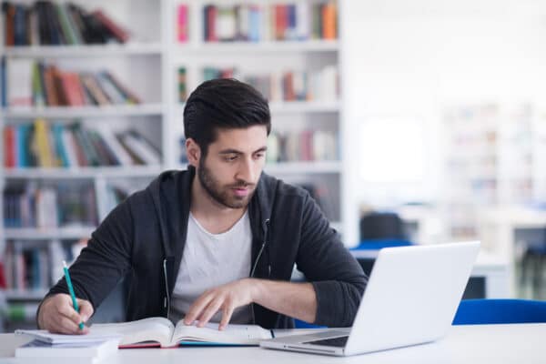 man studying on laptop